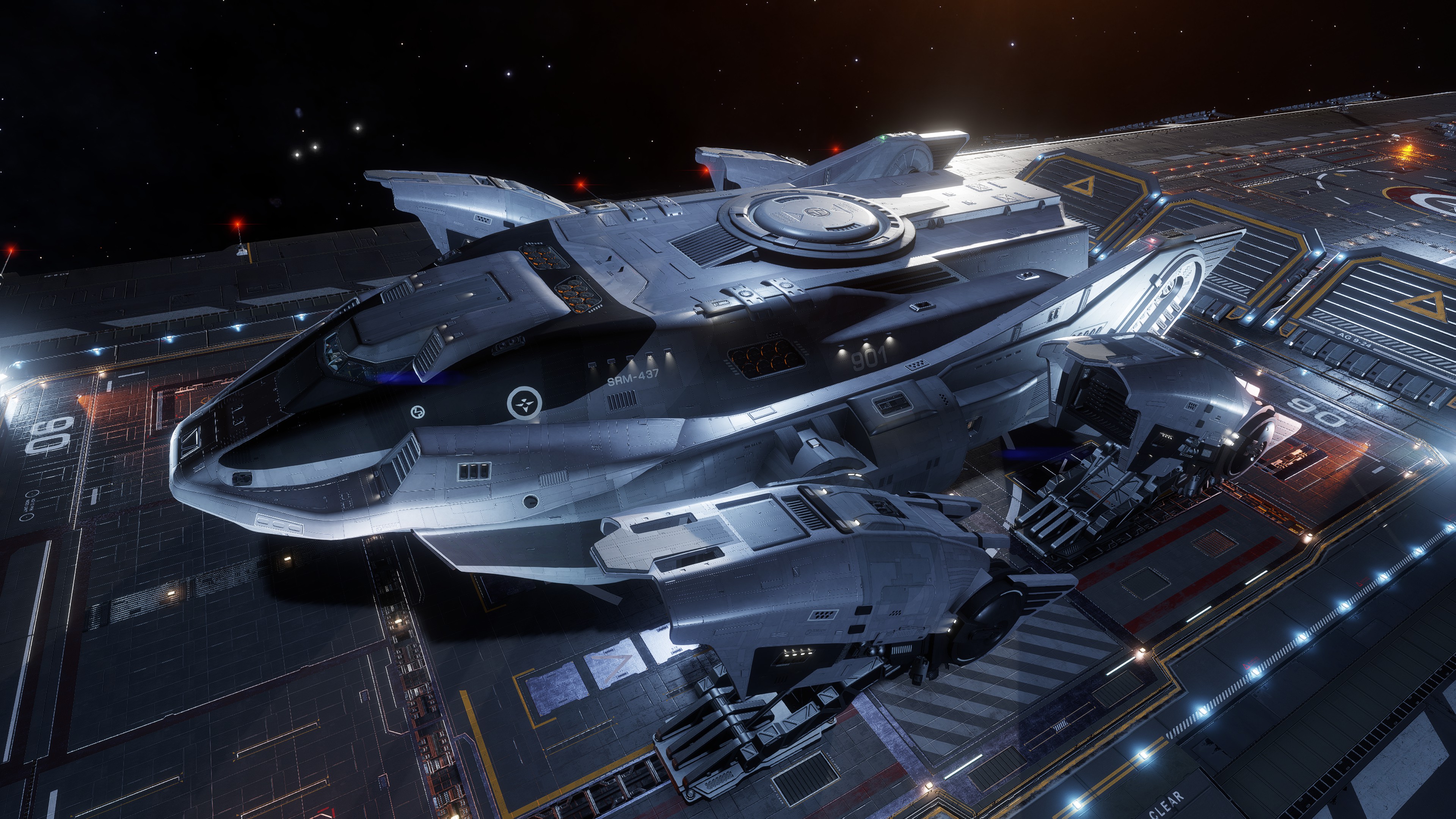 Willy-Willies logistics spacecraft marked SRM-437 parked on an illuminated carrier flight deck in Elite Dangerous.