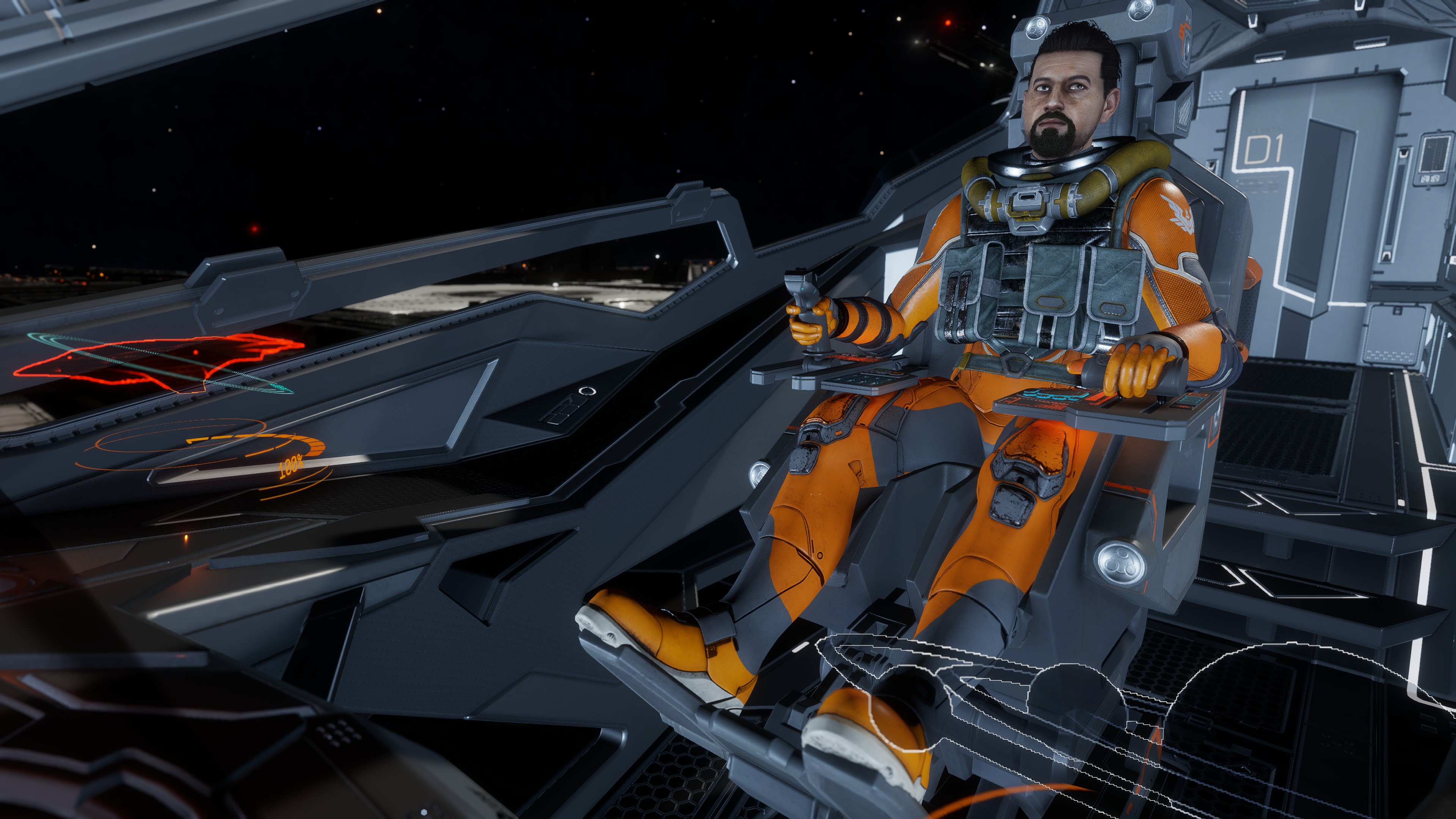 Jackaroos pilot in an orange flight suit seated at the controls of an Elite Dangerous cockpit.