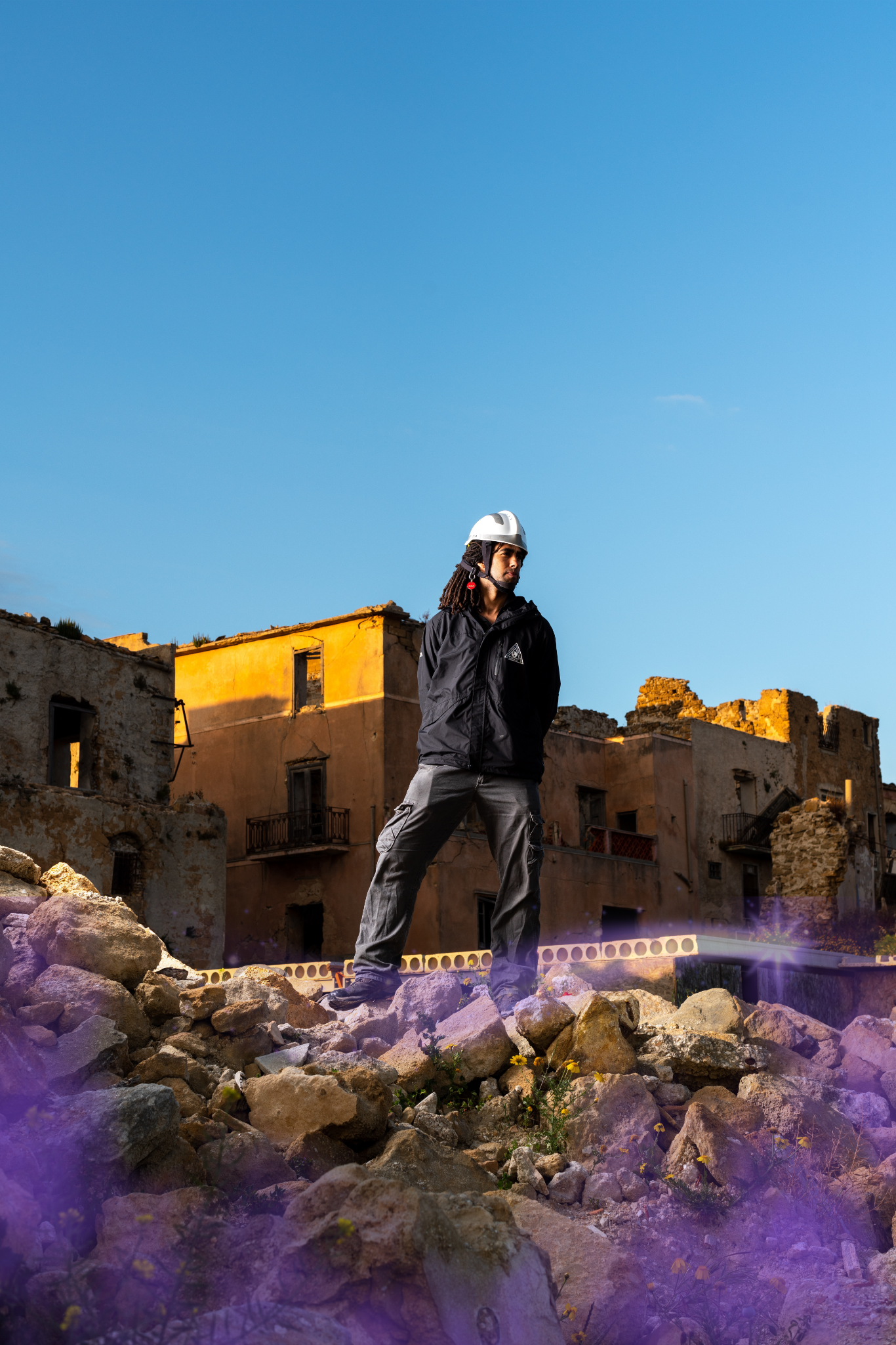 Civilomancy.png A man in a hard hat standing over a construction quarry with purple glowing magic in the rocks