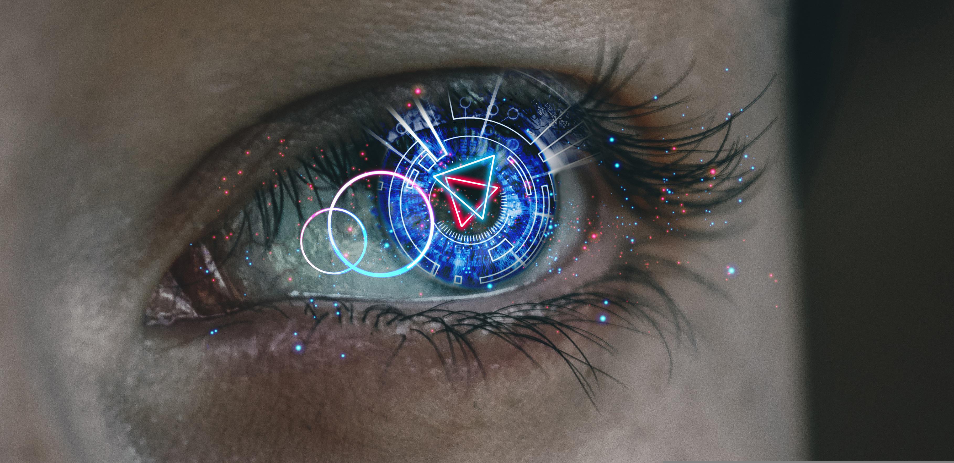 A glowing tech hologram with geometric patterns radiating from a closeup of an eye