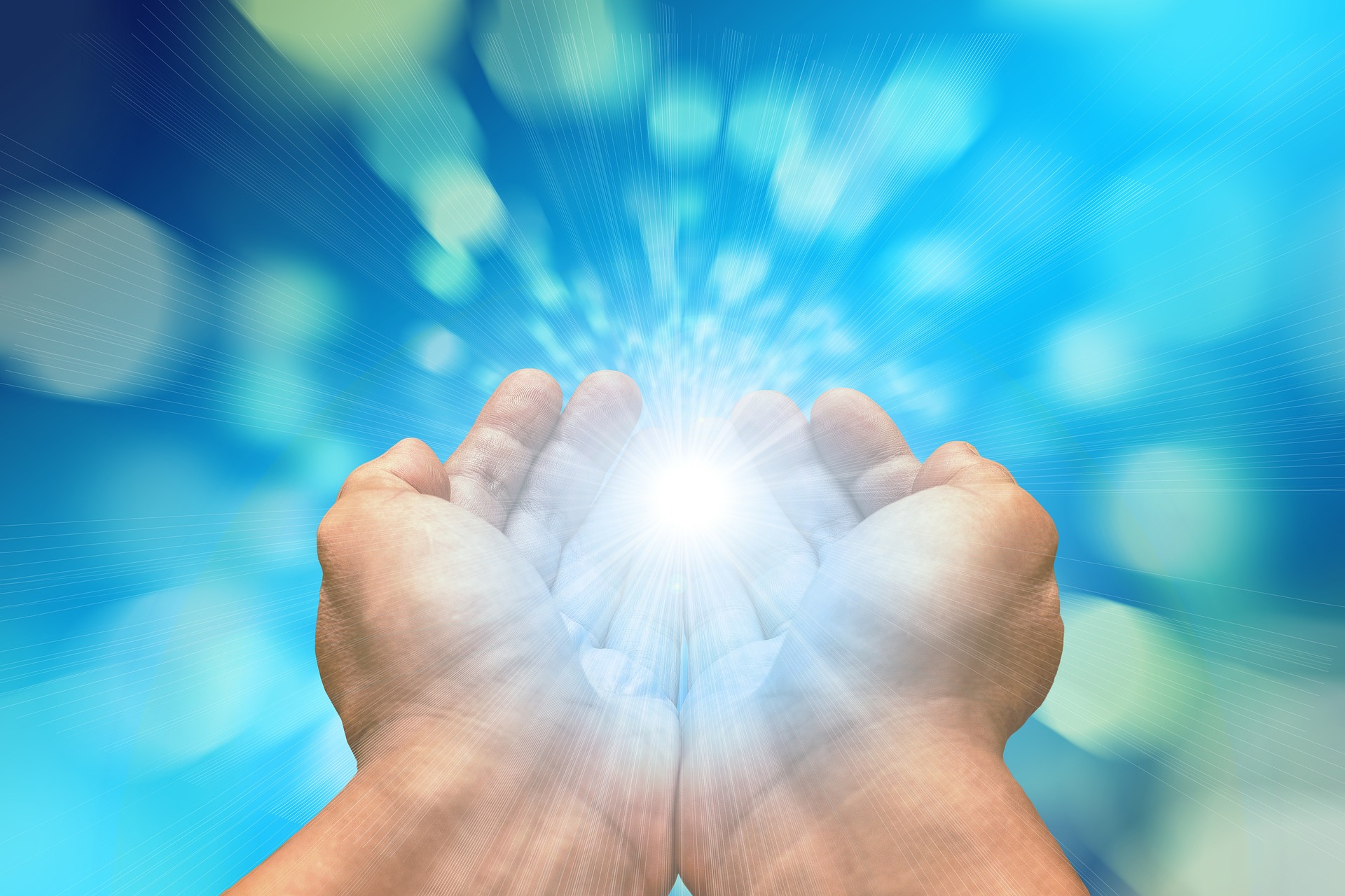A pair of hands, palms open, radiating a bright, white glow, against a bright blue background