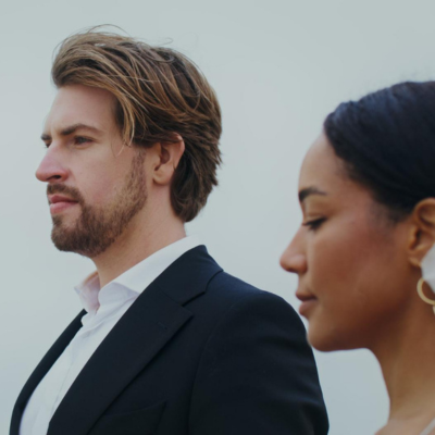 Mart Production.png Man in suit next to woman in dress