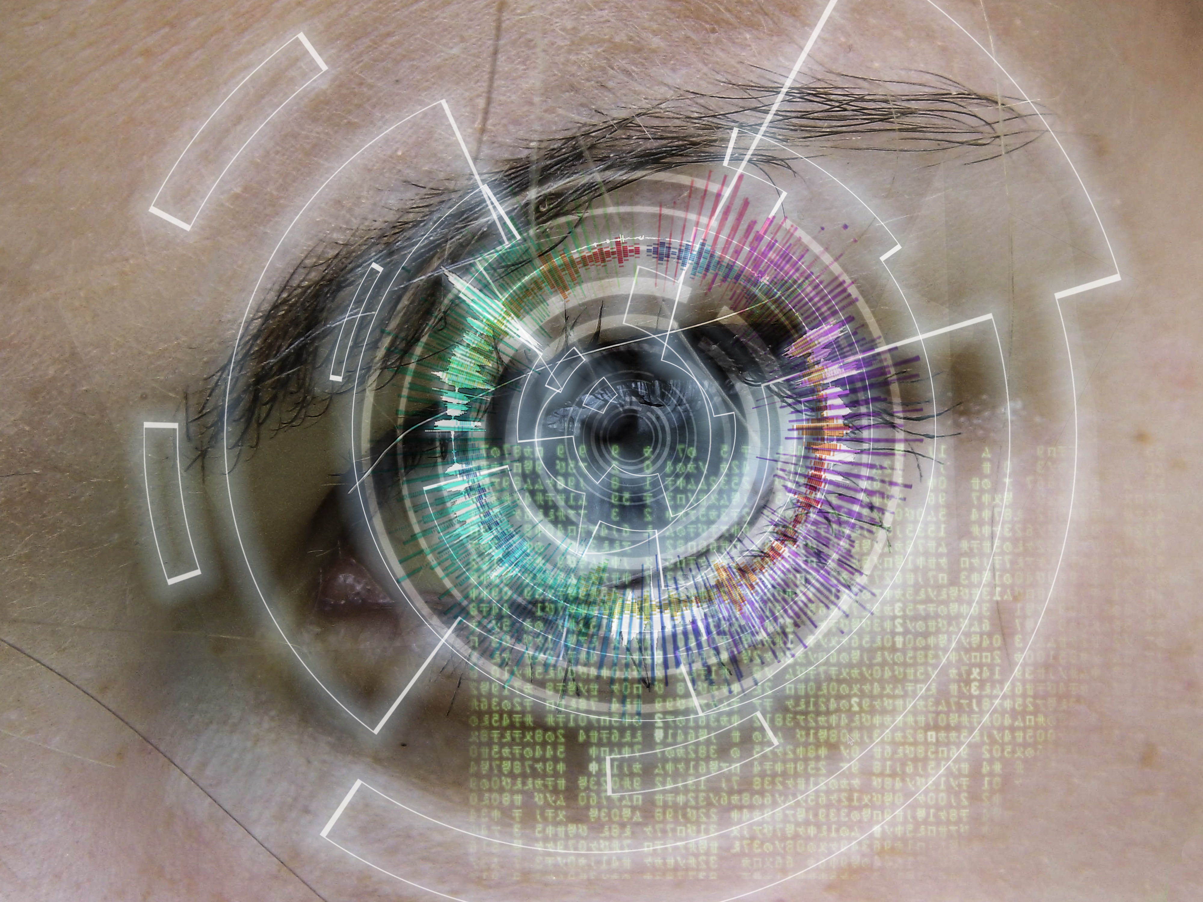 A tech hologram and binary code radiating from an eye in closeup