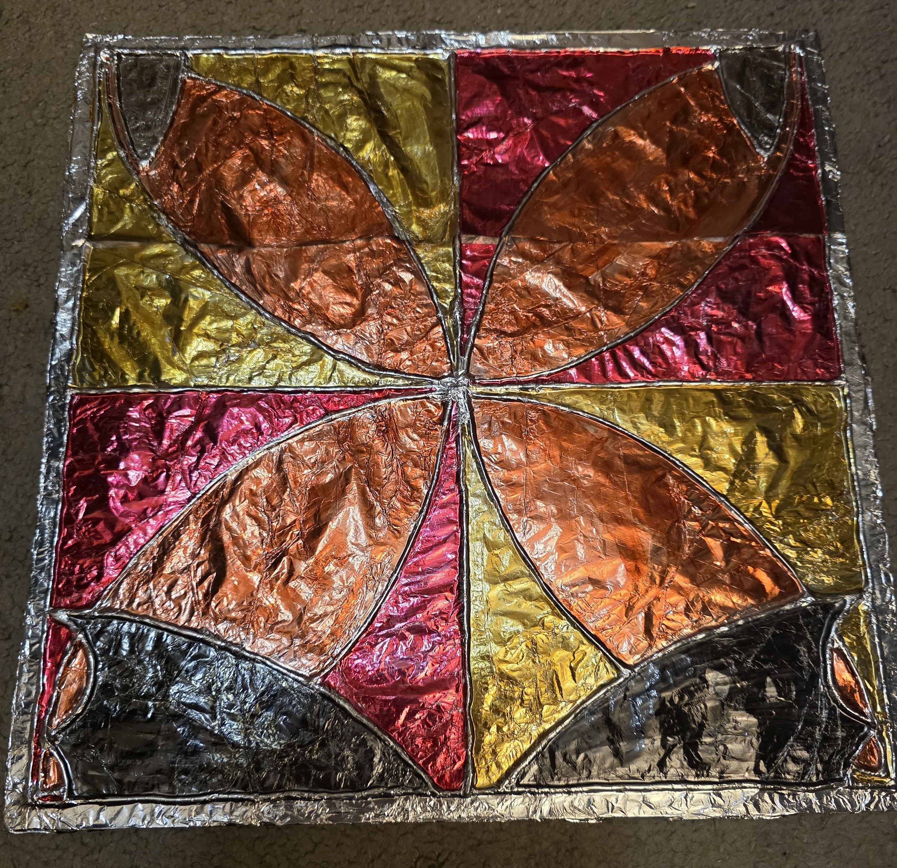 photo of stained glass craft made with aluminium foil, cardboard and hot glue